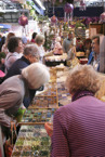 Visitors browse a selection of beads at one of our craft fairs. 