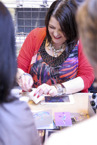 Visitors watch a papercraft demonstraion at one of our craft shows.